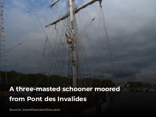 A three-masted schooner moored downstream from Pont des Invalides