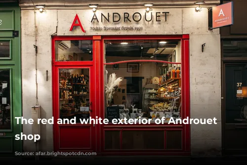 The red and white exterior of Androuet cheese shop 