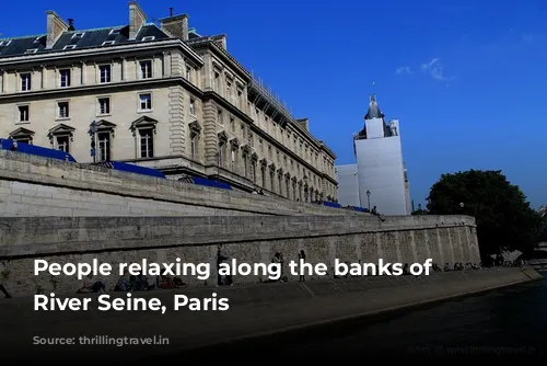 People relaxing along the banks of the River Seine, Paris