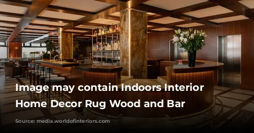 Image may contain Indoors Interior Design Home Decor Rug Wood and Bar