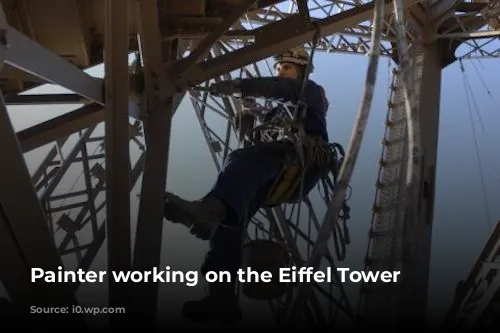 Painter working on the Eiffel Tower