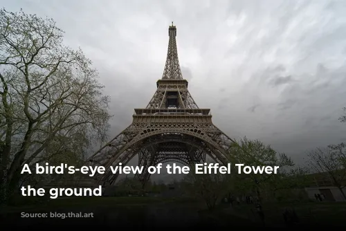 A bird's-eye view of the Eiffel Tower from the ground