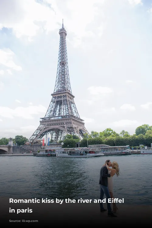 Romantic kiss by the river and Eiffel tower in paris