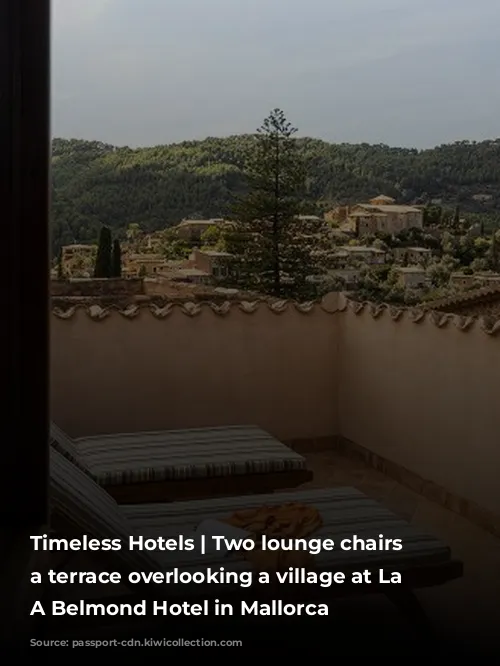 Timeless Hotels | Two lounge chairs on a terrace overlooking a village at La Residencia, A Belmond Hotel in Mallorca