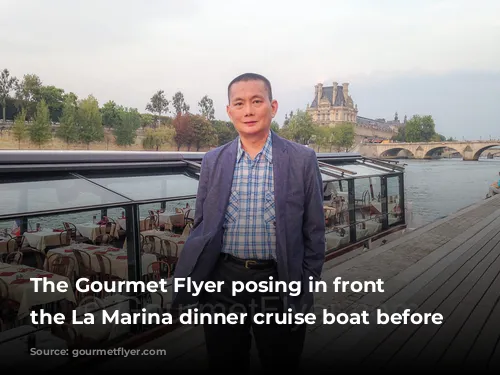 The Gourmet Flyer posing in front of the La Marina dinner cruise boat before departure.