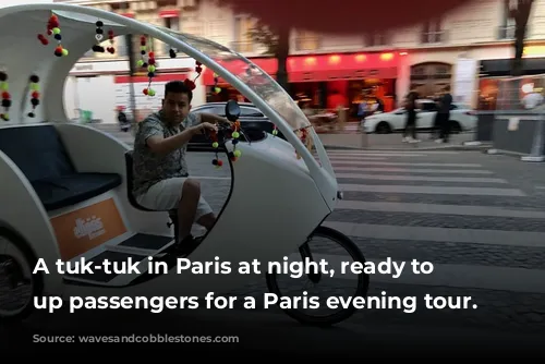 A tuk-tuk in Paris at night, ready to pick up passengers for a Paris evening tour.