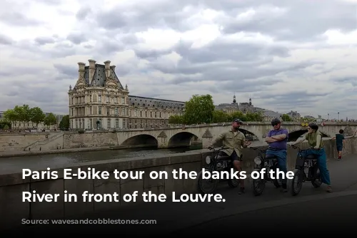 Paris E-bike tour on the banks of the Seine River in front of the Louvre.