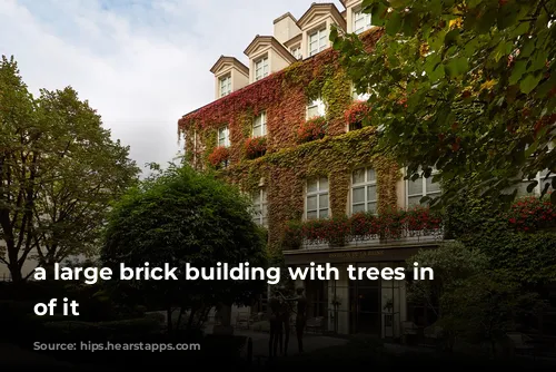 a large brick building with trees in front of it