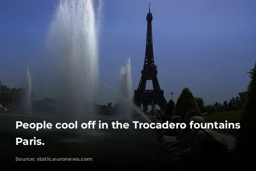 People cool off in the Trocadero fountains in Paris. 