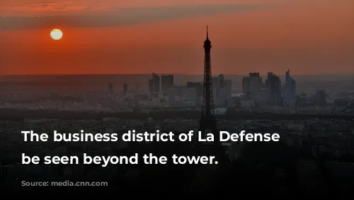 The business district of La Defense can be seen beyond the tower.  