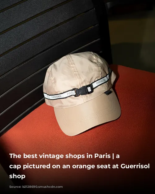 The best vintage shops in Paris | a beige cap pictured on an orange seat at Guerrisol vintage shop