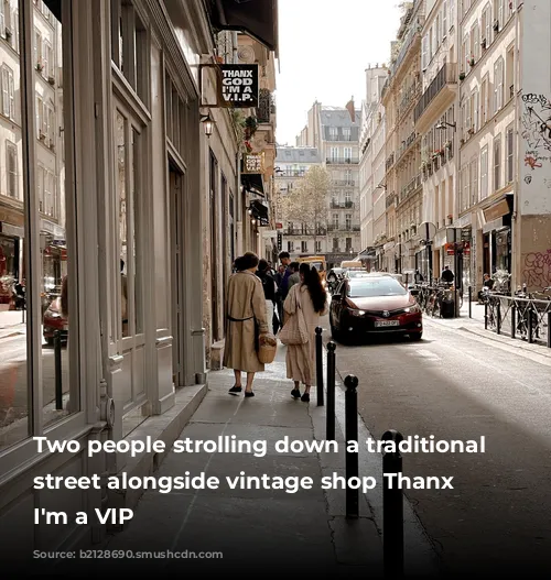 Two people strolling down a traditional Parisian street alongside vintage shop Thanx God I'm a VIP