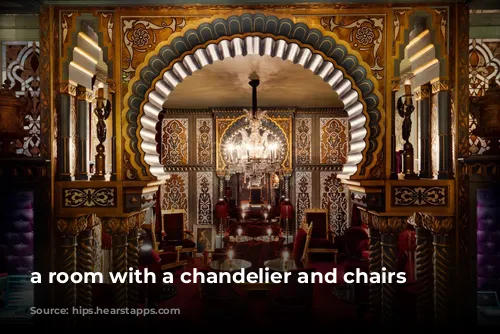 a room with a chandelier and chairs