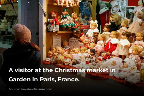 A visitor at the Christmas market in Tuileries Garden in Paris, France.