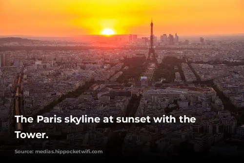 The Paris skyline at sunset with the Eiffel Tower.