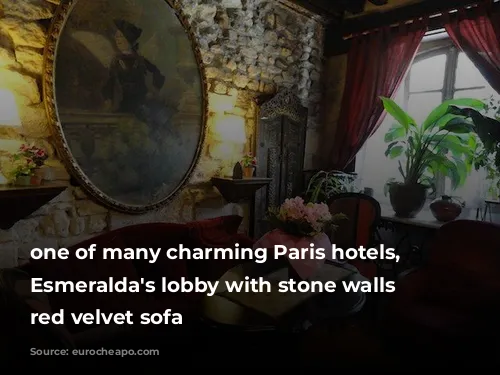 one of many charming Paris hotels, Hotel Esmeralda's lobby with stone walls and red velvet sofa