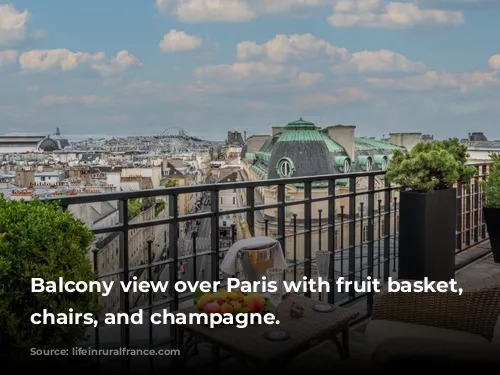 Balcony view over Paris with fruit basket, wicker chairs, and champagne.