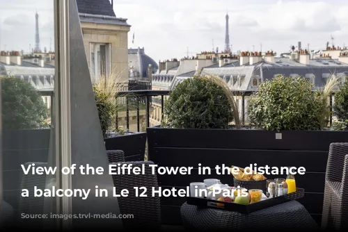 View of the Eiffel Tower in the distance from a balcony in Le 12 Hotel in Paris