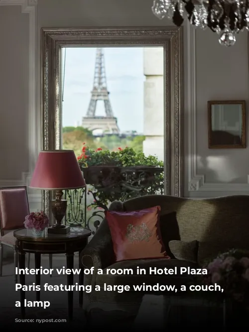 Interior view of a room in Hotel Plaza Athenee, Paris featuring a large window, a couch, and a lamp