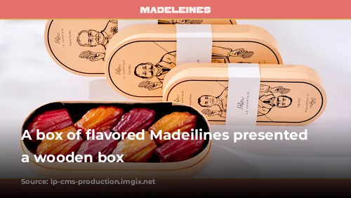 A box of flavored Madeilines presented in a wooden box