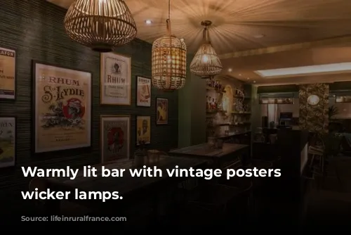 Warmly lit bar with vintage posters and wicker lamps.