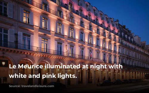 Le Meurice illuminated at night with soft white and pink lights.