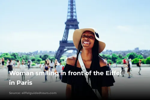 Woman smiling in front of the Eiffel Tower in Paris