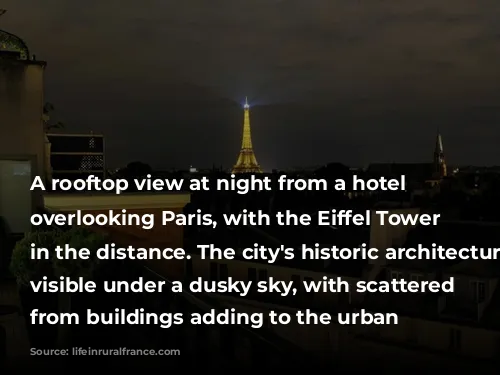 A rooftop view at night from a hotel balcony overlooking Paris, with the Eiffel Tower illuminated in the distance. The city's historic architecture is visible under a dusky sky, with scattered lights from buildings adding to the urban ambiance.