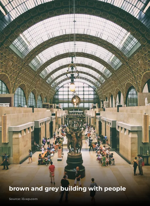 brown and grey building with people inside