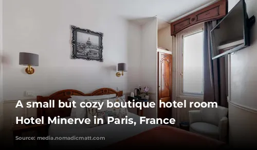 A small but cozy boutique hotel room at Hotel Minerve in Paris, France