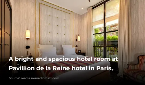 A bright and spacious hotel room at the Pavillion de la Reine hotel in Paris, France