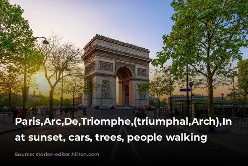 Paris,Arc,De,Triomphe,(triumphal,Arch),In Chaps,Elysees, at sunset, cars, trees, people walking